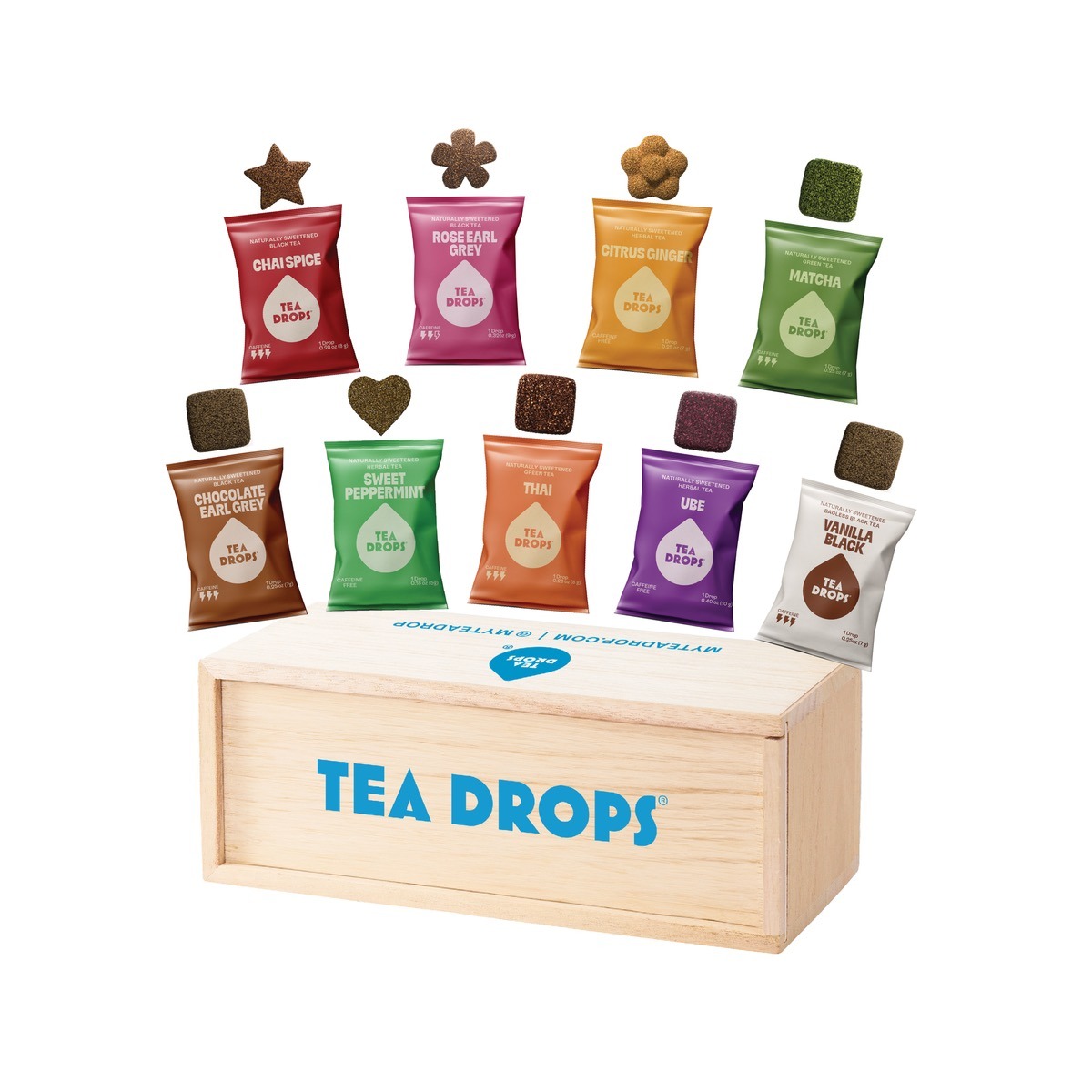 Tea Drops branded wooden sampler box with assorted dissolvable pressed-tea drops in star, flower, and heart shapes plus wrapped flavor packets
